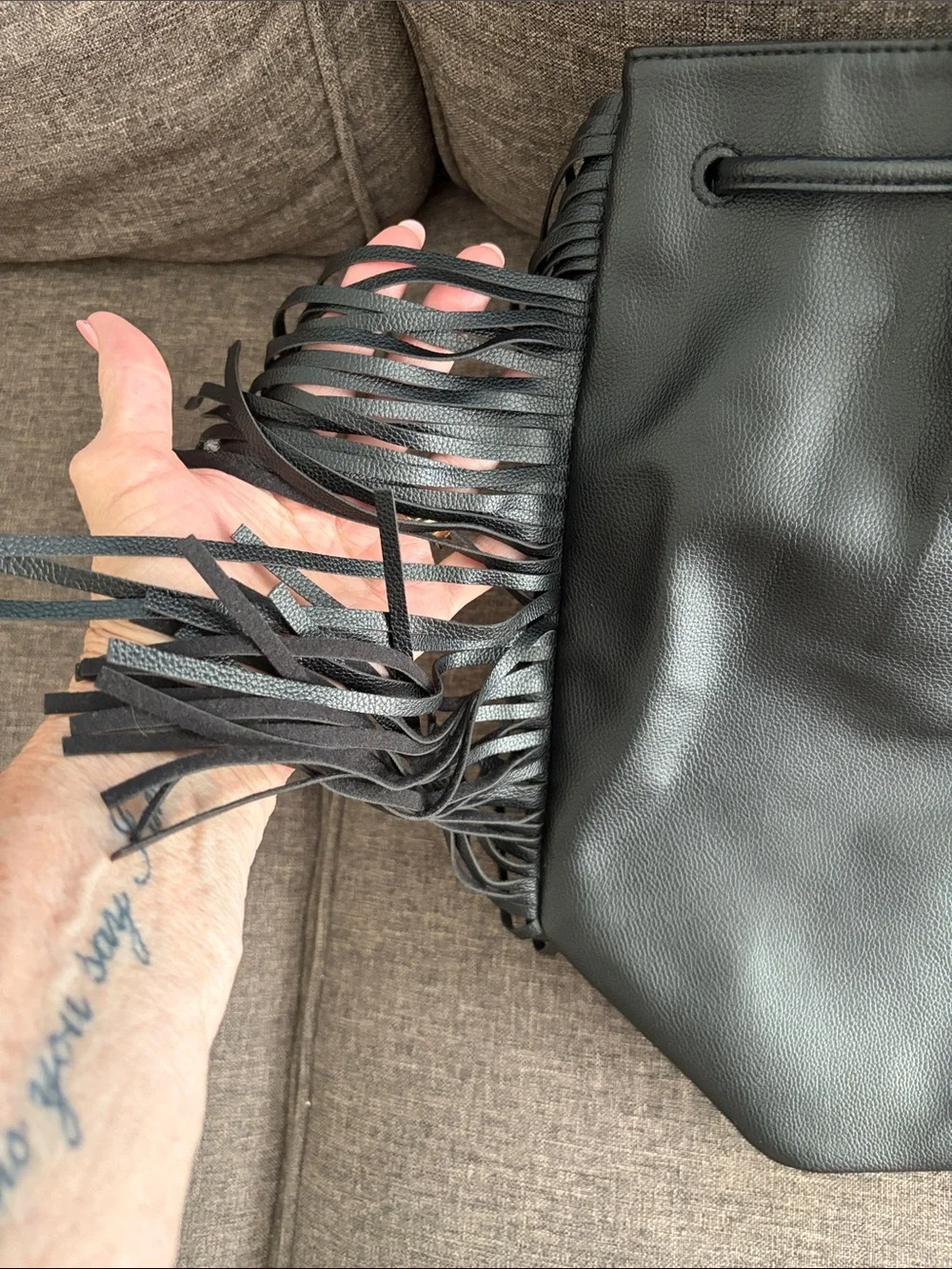 Victoria's Secret Black Fringe Drawstring backpack.